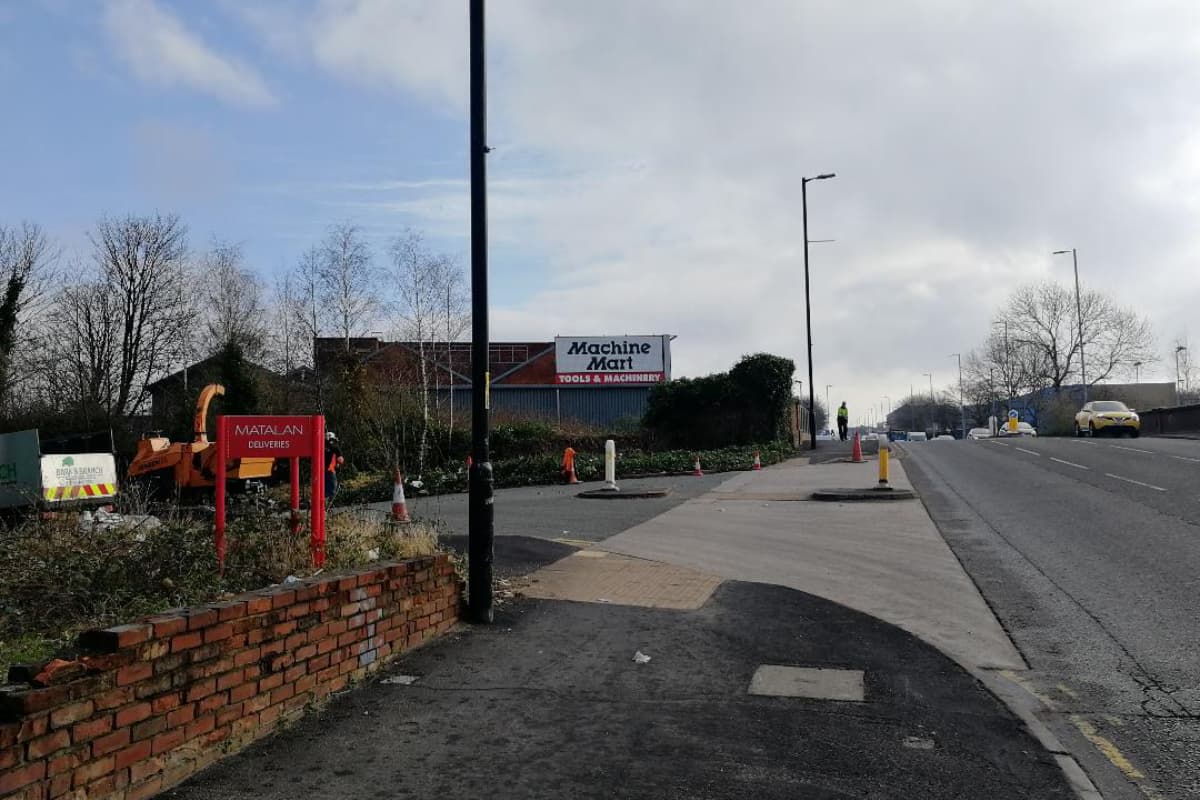 Machine Mart's signage after we've removed trees and vegetation